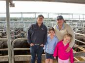 Thomas DeGaris & Clarkson's Sam Hill, Penola, with Bec Barry, Apsley, and children Oliver and Charlotte, bought 28 Angus steers. Pictures by Jacqui Bateman 
