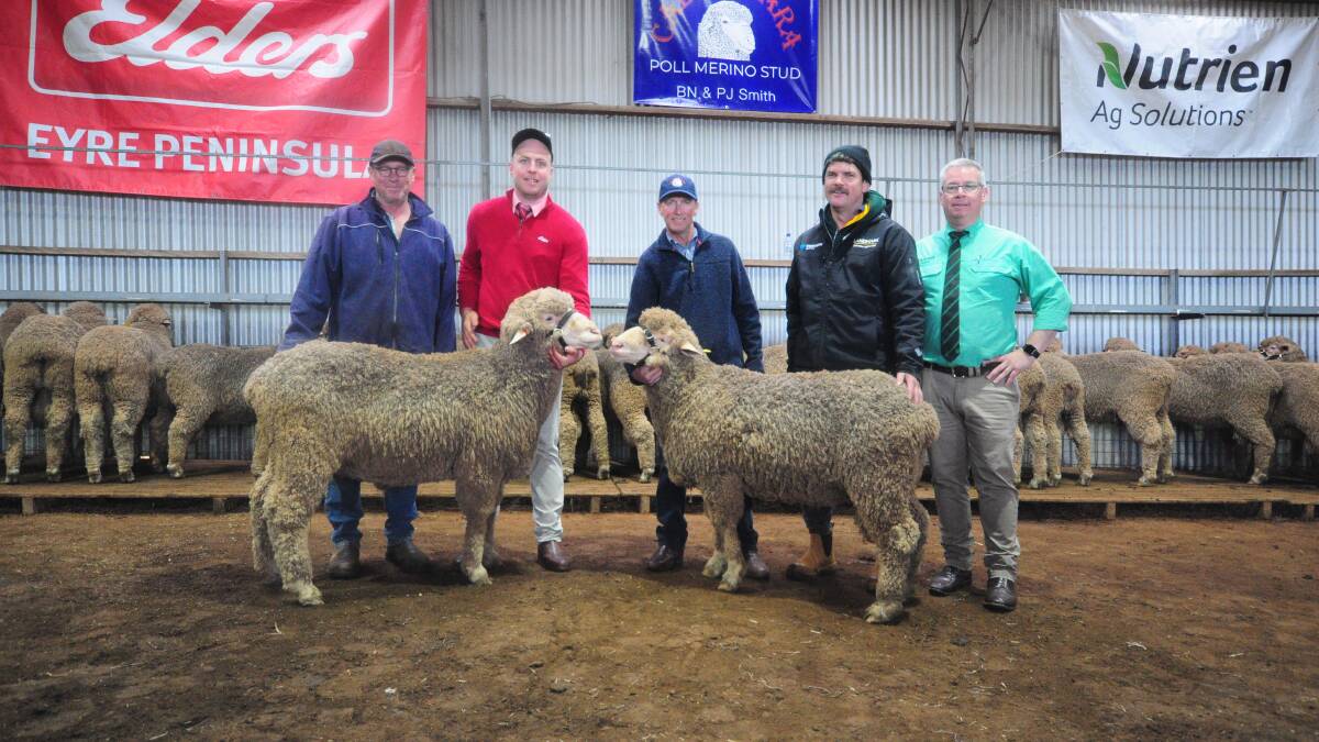 Buyer Paul Turner, Cleve, Elders Cowell agent Dylan Jagy, Calcookara principal Brenton Smith, buyer Chris Puckridge, Cummins, and Nutrien auctioneer Gordon Wood with the top and second top price rams. Picture by Katie Jackson