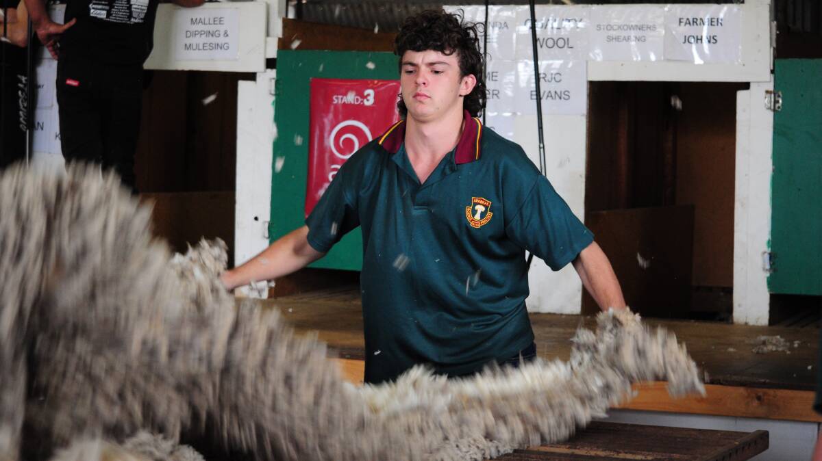 Jacob Scales, Urrbrae Agricultural High School, throws a fleece during the competition.