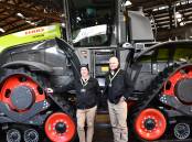 Bascombe Auto Ag sales representative Stuart Burrows and dealer principal Scott Bascombe with the CLAAS XERION 12.650 TERRA TRAC, which won Tractor of the Year at Agritechnica. Picture by Paula Thompson