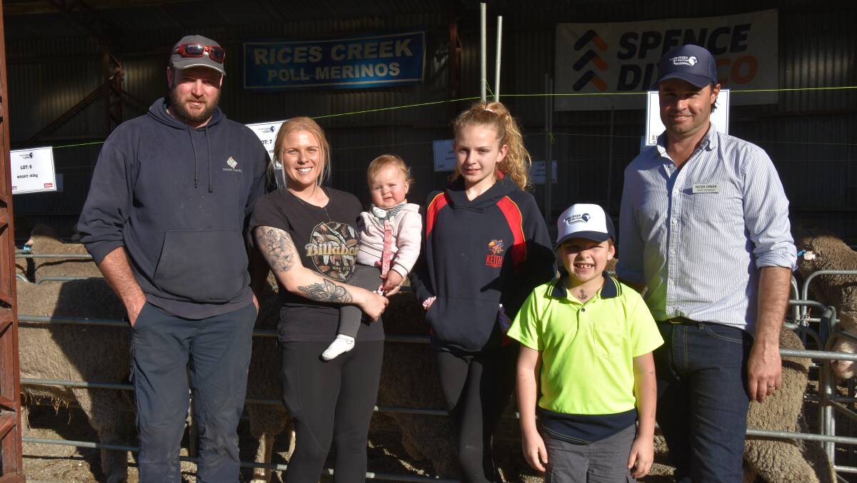 Adam and Hannah Zacker, Zacker Pastoral, Tintinara and their children Halle, Bella and Harry pictured with Mark Vandeleur were one of the volume buyers. They bought eight rams for a $2450 average.