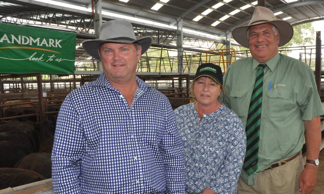 Tallageira Pastoral Co's Kevin and Kim Knight who manage Demijohn, Lucindale and their agent Landmark key account manager David Heinrich with the top pen of their Angus steers at the Naracoorte sale which made $1318. In total their 132 steers averaged $1193.