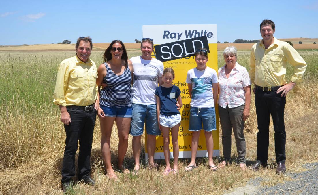 GREAT OFFER: The Bradley family sold their 243-hectare property Toringa at Farrell Flat prior to auction for an undisclosed, but exceptional, sum. Ray White Rural SA joint principal Geoff Schell is with the happy vendors Carly, Aaron, Charlotte, Taylor and Heather Bradley, and fellow principal Daniel Schell.