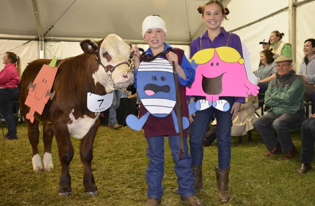 BOOK CHARACTERS: Travis and Holly Wilson, Kerlson Pines stud, Keith, dressed as Mr Bump and Miss Chatterbox with their Poll Hereford calf.