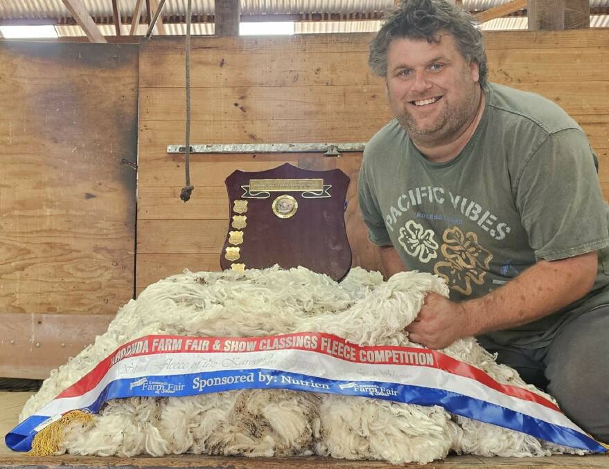 Karoonda Farm Fair Fleece Competition convenor Wade Boughen with the highest value fleece from Orrie Cowie stud, Warooka. Picture supplied.