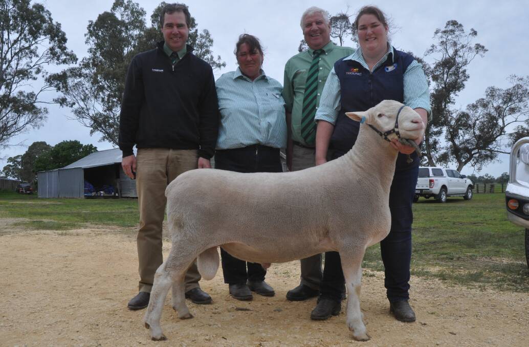 WA FIND: Landmark's Richard Miller and David Heinrich and Kathy and Samantha Kelly with the $3000 ram.
