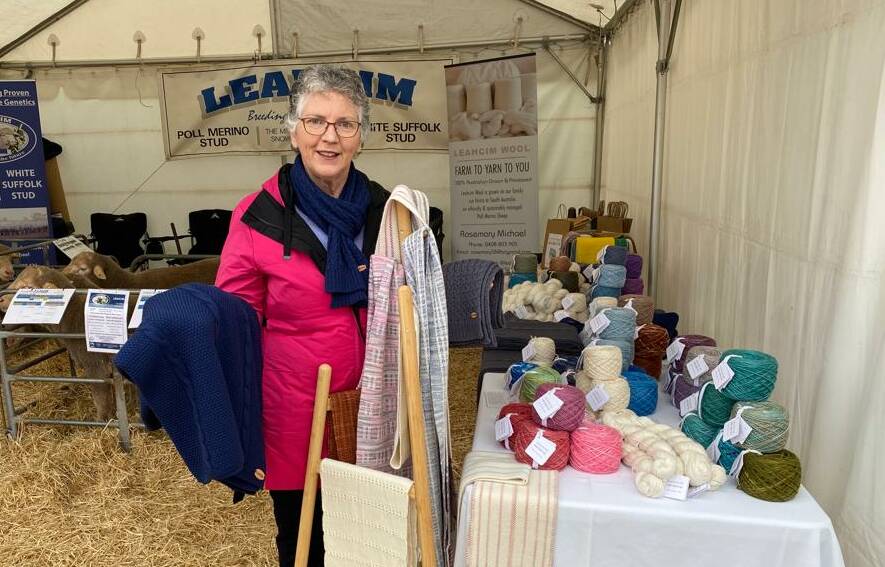 Rosemary Michael with some of the Leahcim Wool: Farm to Yarn to You products which were made by Silver Fleece. 