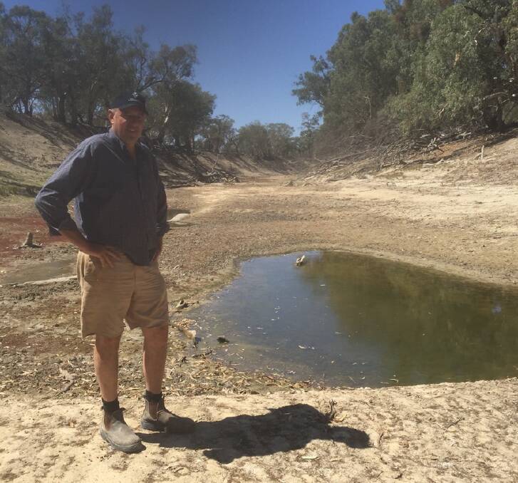 BEFORE: Robert McBride on the Lower Darling riverbed at Tolarno Station in Far West NSW prior to the inflows late last week.