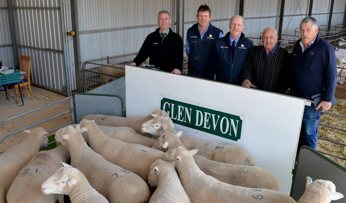 BUY UP: Landmark auctioneer Gordon Wood with Glen Devon co-principals Lachlan and Rob Hart, Two Wells, volume buyer Steve Di Giorgio, Lucindale, and his agent Robin Steen, PPH&S Naracoorte. Mr DiGiorgio bought 12 rams averaging $1233. 