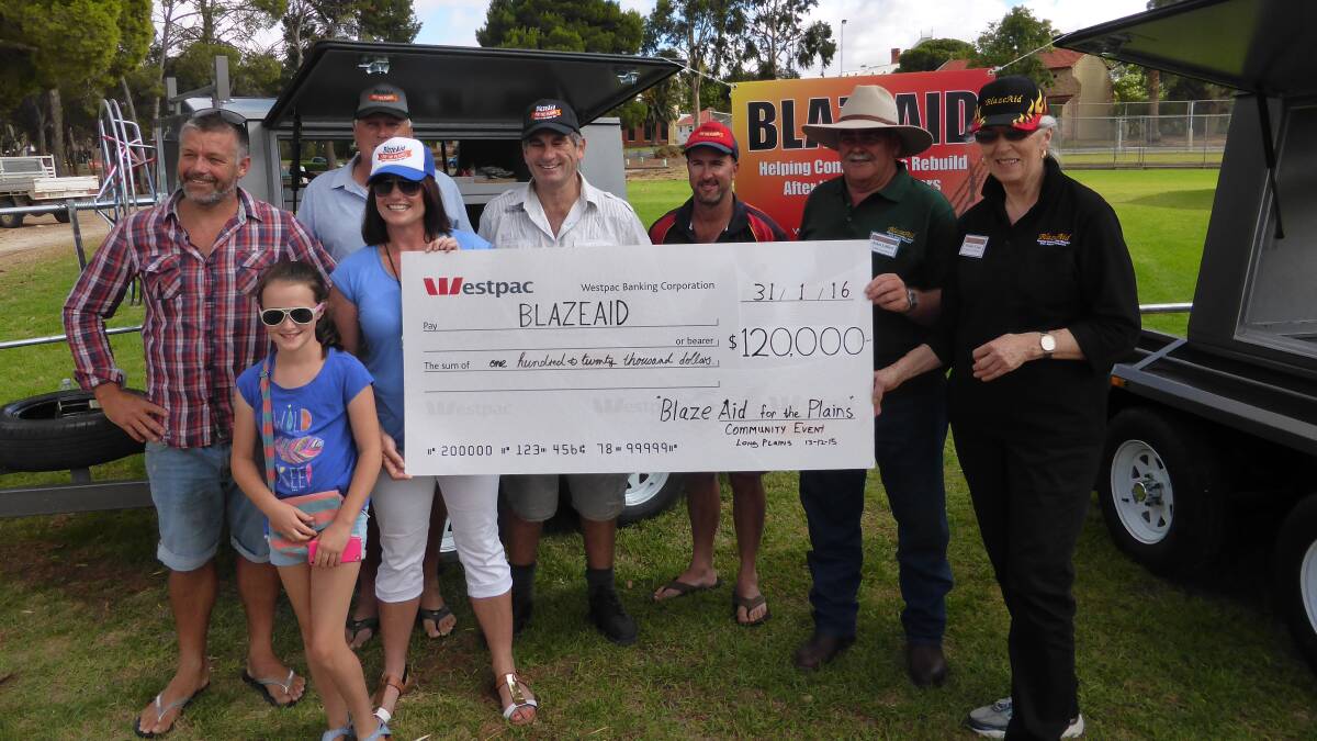 Mid North locals Dylan Stodart, Butch Algar, Ella Brechin, Heather Curnow, Michael Scharman and Jock Brechin present the donation of $120,000 to BlazeAid camp coordinators John Lillico, Hamley Bridge, and Wendy Cope, Roseworthy. The funds will go towards setting up six new trailers.