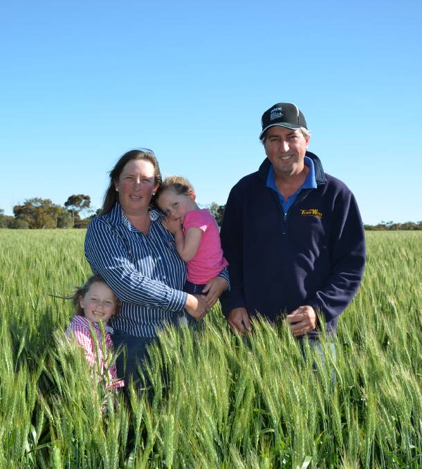 IN CROP: Cindy and Craig Wissell, Ardrossan, with daughters Maddison and Zara, in their Mace wheat. Mr Wissell said there had been no signs of Russian wheat aphids.