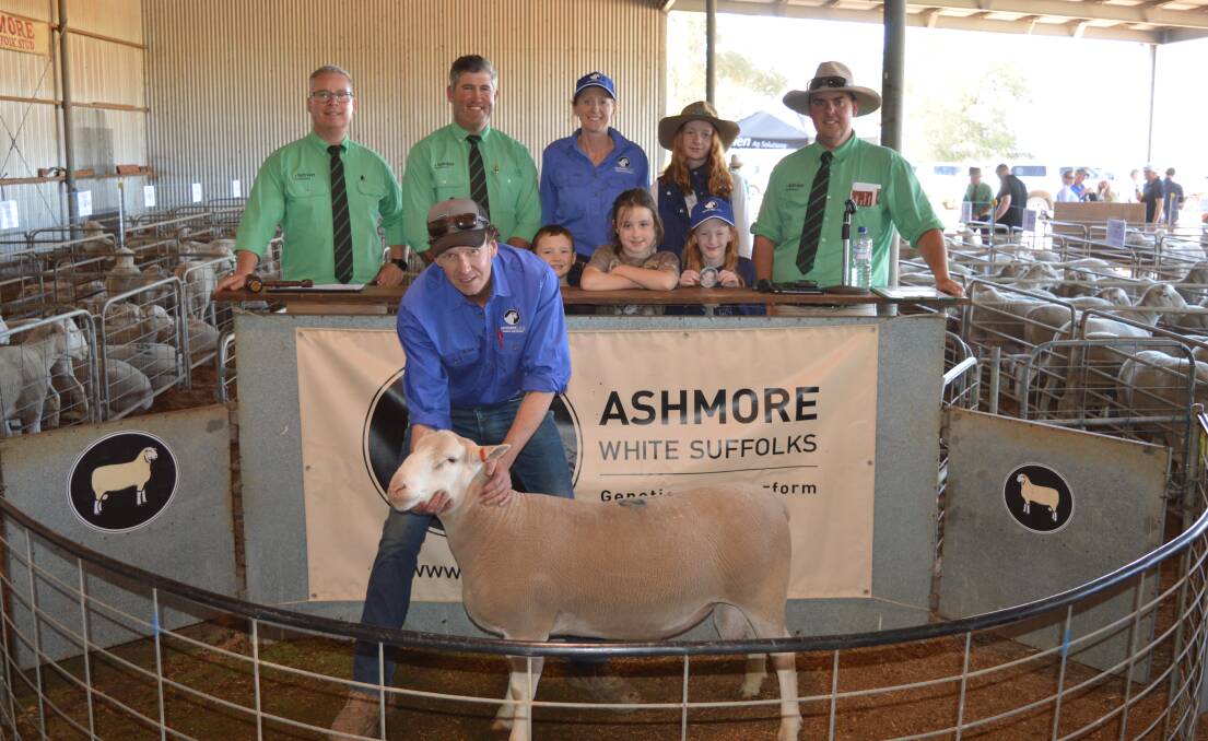 Ashmore stud's Troy Fischer holds the lot 2 sale topper which sold to Fingerpost stud, Monarto South. Also pictured are Nutrien's Gordon Wood, Andrew Wilson and Peter Marschall (far right) and Nette, Indigo and Elke Fischer and Riley and Jake Shewan. Picture supplied 