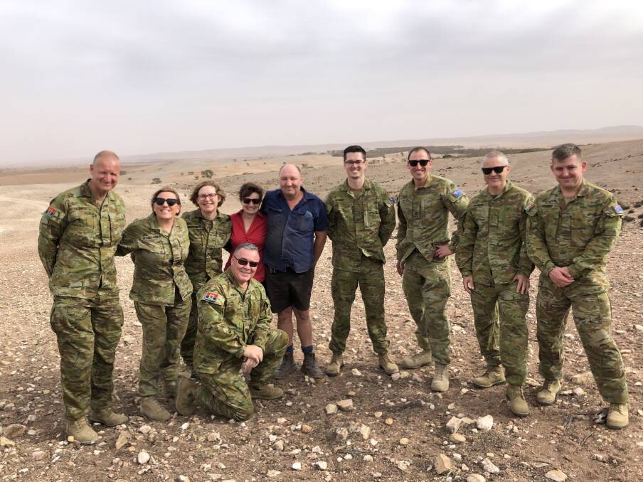 AUSTRALIAN ARMY: Christopher Monks, Jade O'Halloran, Amanda Griffiths, Robertstown farmers Gayle and Adrian Schmidt, Shaun Evans, Peter Bell, Stephen Taylor and Aaron Austin, and (front) Al Kidney. 