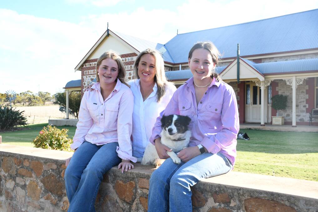 Jade Inglis with her daughters Adele and Eliza in front of the family homestead.