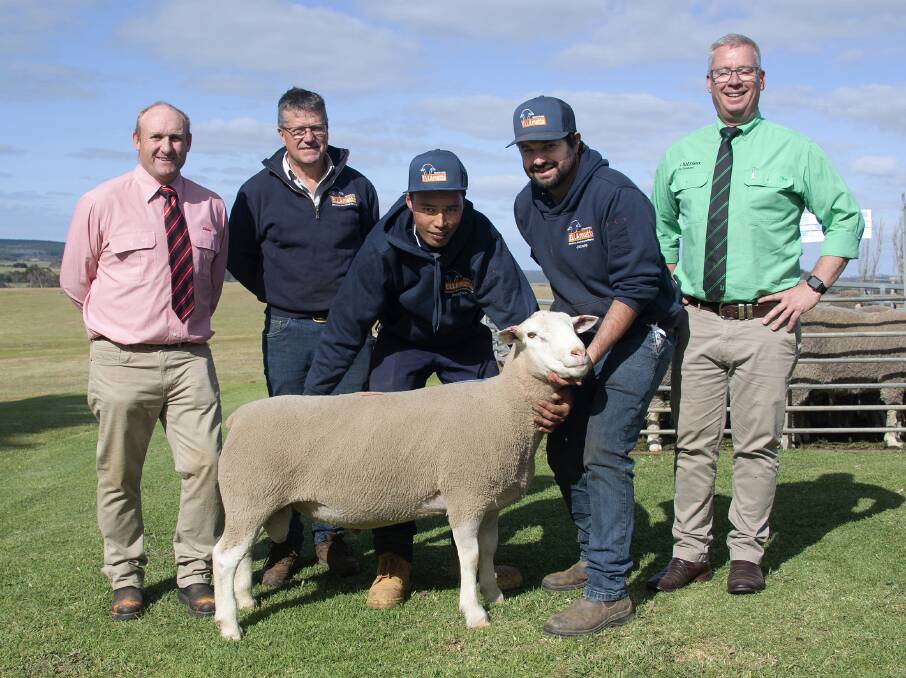 The top-priced White Suffolk and overall sale ram at $5400 was bought by Lindsay Price, Paskeville, through AuctionsPlus. It is pictured with Elders KI's Greg Downing, Ella Matta's Andrew Heinrich, Stephen Warena and Jamie Heinrich, and Nutrien stud stock's Gordon Wood. Pictures by Ian Turner
