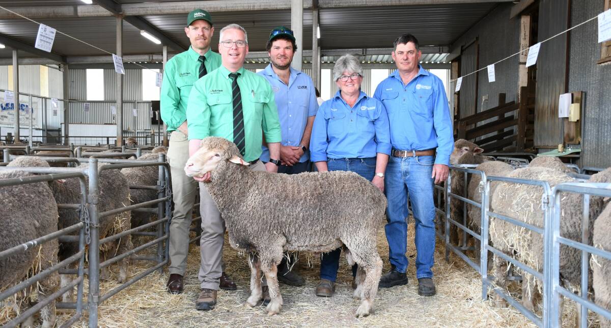 Nutrien Jamestown's Tom Allen, Nutrien stud stock's Gordon Wood, and Leahcim's Alistair Michael congratulate Trudy and Bruce Pengilly, Penrose Poll Merinos, Lort River, WA, on their $8000 purchase.
