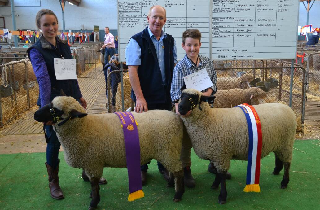 EVEN EWES: Claire and Riley Pearce, Telpara, Mount Torrens, and judge Peter Button (centre), Ramsay Park, Minlaton, with the stud's top performing ewes. The champion ewe weighed 99.5kg, with 14mm fat depth.