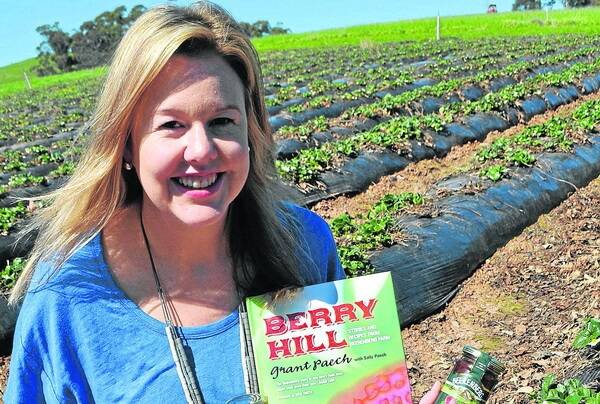 SWEET THRILL: Strawberry lover and Beerenberg marketing manager Sally Paech with her family's recently released book Berry Hill: Stories and Recipes from Beerenberg Farm.