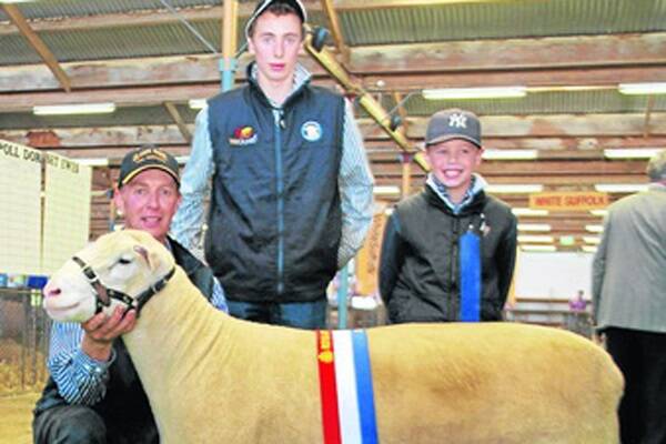 One of the British Breed ram sale highlights was the sale of Ulandi Park  Poll Dorset stud’s supreme exhibit for $15,000 at the Adelaide Elite Ram Sale. Pictured  with the ram is stud principal Clayton Rowett, Marrabel, and his sons Charles and Henry.