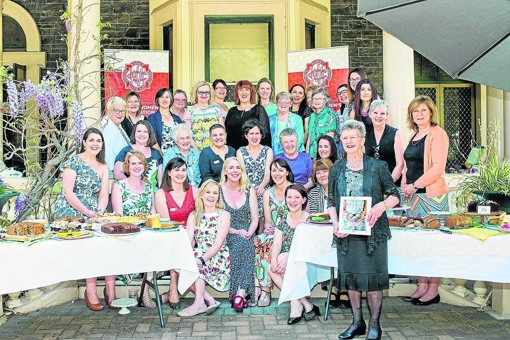 State president Linda Bertram (front) with 32 of the 52 contributors to the Calendar of Cakes book. • Photo: Jacqui Way and Sarah Quinn.
