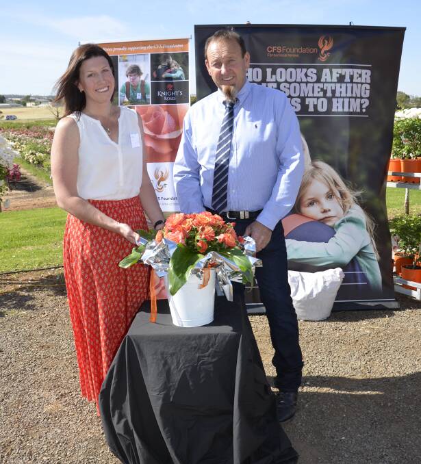 ROSE LAUNCH: Kellie Harrison, whose husband passed away fighting a fire in 2014, and Knight's Roses' David Knight.