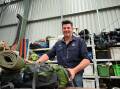 Team leader David Russell, Aldinga Beach, is at the Operation Flinders warehouse with a pack. Pictures supplied