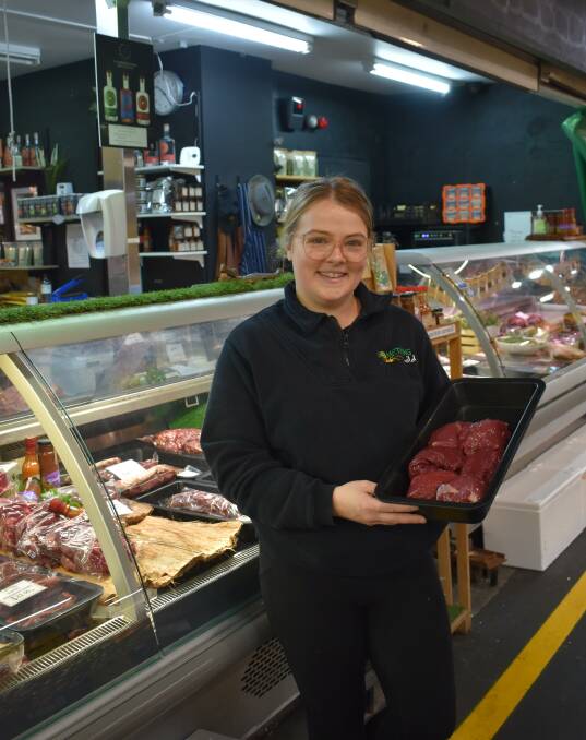 Something Wild operations manager Alice Frazer holds kangaroo ready to be packaged for the shop window. 