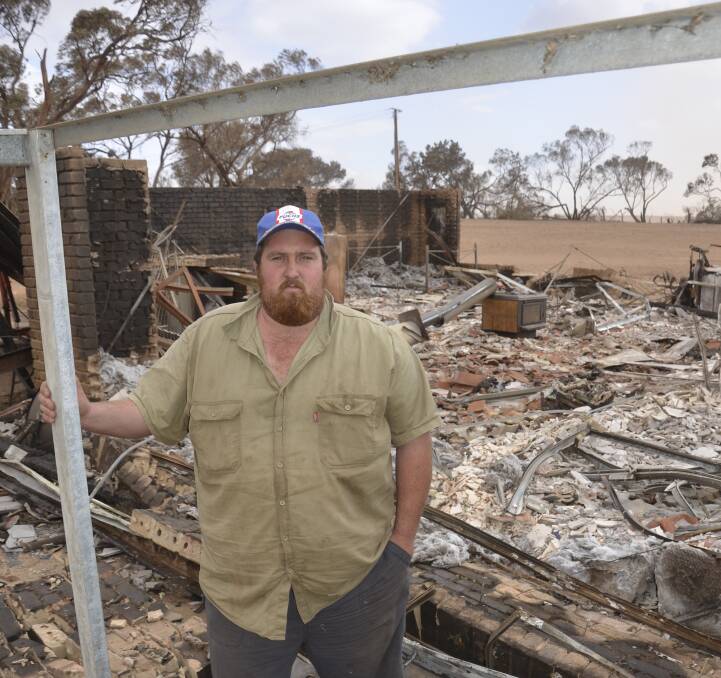 TOTAL DEVASTATION: Ryan Hackett surveys what little is left of his sister and brother-in-law's house south-west of Hamley Bridge. While the house is completely destroyed, a nearby carport and shed are still standing.